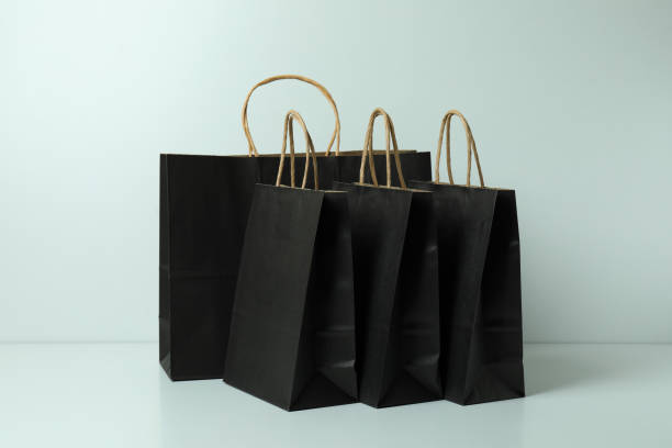 istock Group of black paper bags on white background 1307781913