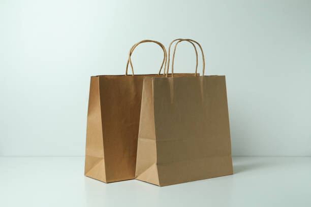 istock Blank paper bags on white background, space for text 1307782026
