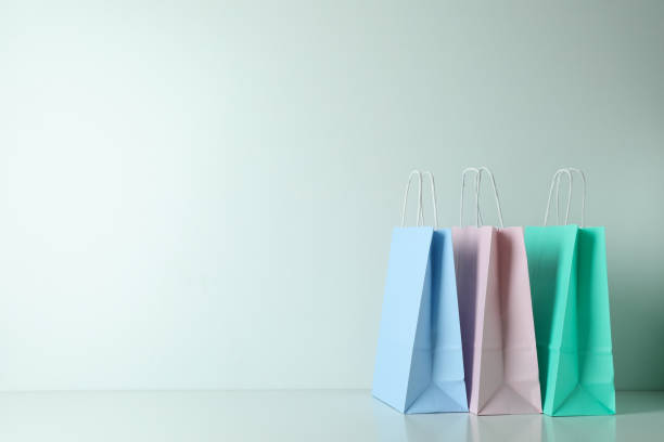 istock Blank colorful paper bags on white background 1307782311