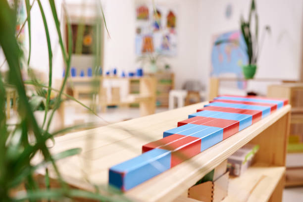 Light class in Montessori kindergarten. The colorful numeric rods in the foreground. nobody