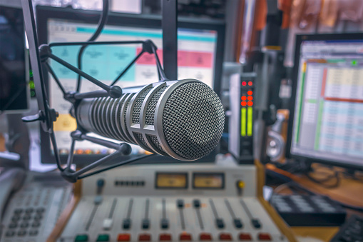 Professional microphone and sound mixer in radio station studio