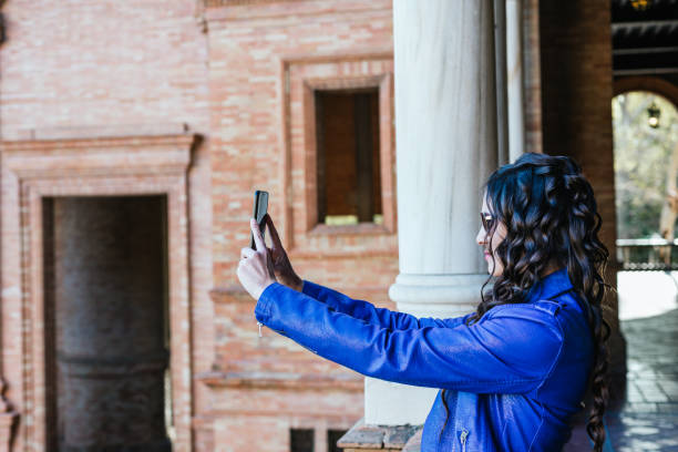 istock Young man taking photo on a smartphone 1307784293