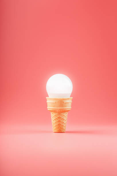 istock Light bulb ice cream in a waffle Cup on a pink background. 1307784305