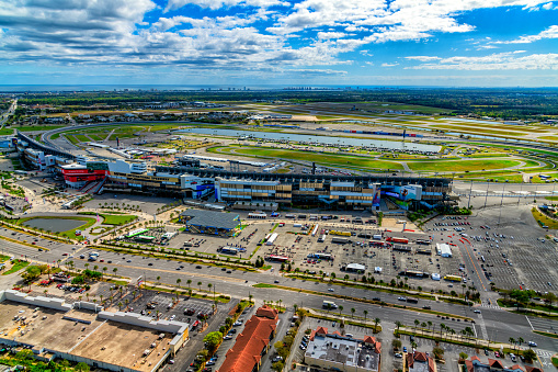Daytona Beach, United States - March 10, 2021:  Wide angle aerial view of the famous Daytona International Speedway, host to NASCAR's Daytona 500 among many other events and has a capacity of over 100,000 permanent seats.