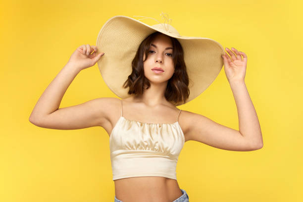 istock tanned young woman in summer hat 1307787819