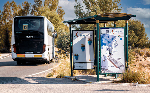 Frigiliana, Spain, Oct. 30, 2019.\nBus stop and leaving bus between Frigiliana and  Nerja, Southern Spain