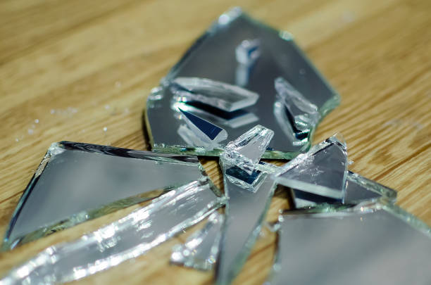 istock Broken mirror fragments, bad omen, superstition. Close-up, selective focus. 1307787970