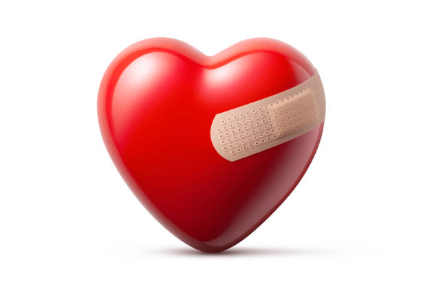 istock Wounded heart. Heart with adhesive bandage. 1307789290