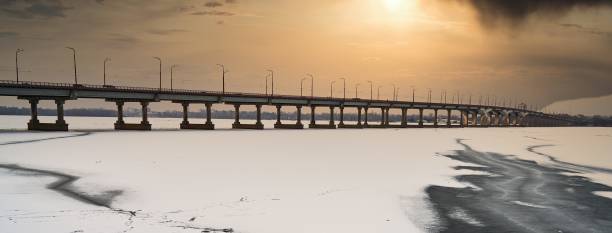 istock bridge over the river at sunset 1307791545