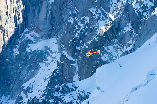 Mountain rescue helicopter in the Mont Blanc massif, Chamonix, France