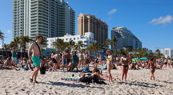 Fort Lauderdale, Florida, USA - March 17, 2021:  Crowds of college students on Spring Break at Fort Lauderdale Beach.