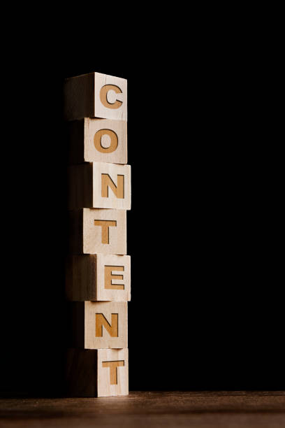 istock Content written on wooden toy blocks, black background 1307796364