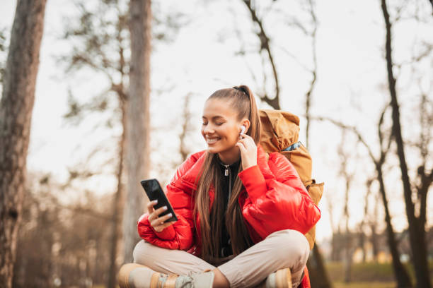 istock Happy young woman enjoying in nature 1307796371