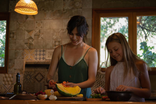 istock mother and daughter cook a casuela 1307797063