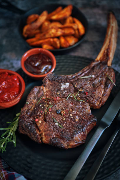 istock Tomahawk Steak with Country Potatoes 1307797413