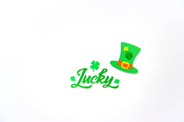 istock Brush calligraphy design with clover shamrock leaf and Leprechaun's hat. 1307801396