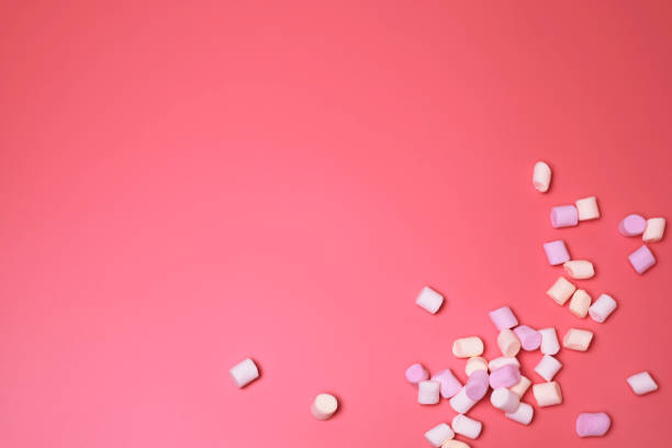 istock Marshmallows on the pink background, with free space for text. 1307805732