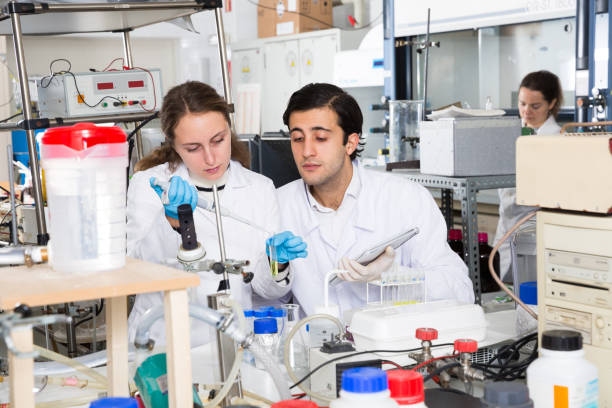 istock Students recording results of lab experiments 1307805919