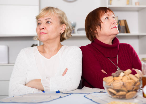istock Old women in the kitchen quarrel 1307805940