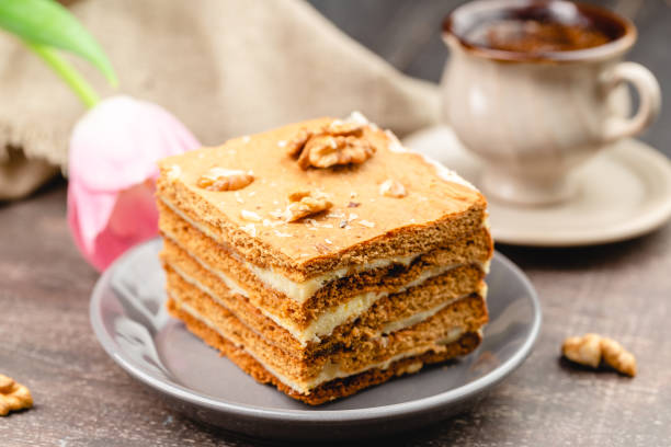 istock Slice of layered honey cake selective focus 1307807741