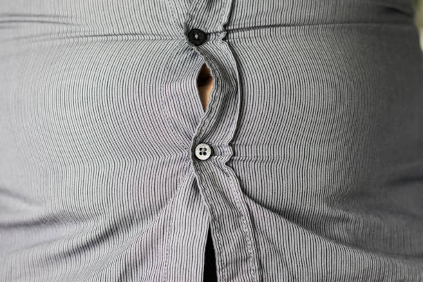 istock Fat belly under a striped shirt 1307807928