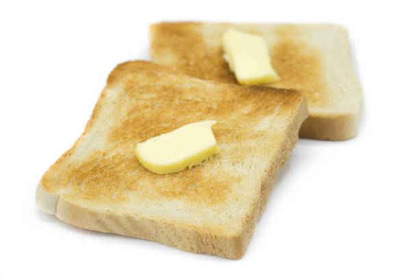 istock Toast bread with butter isolated on white background 1307808693