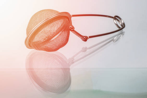 Tea strainer on glass surface