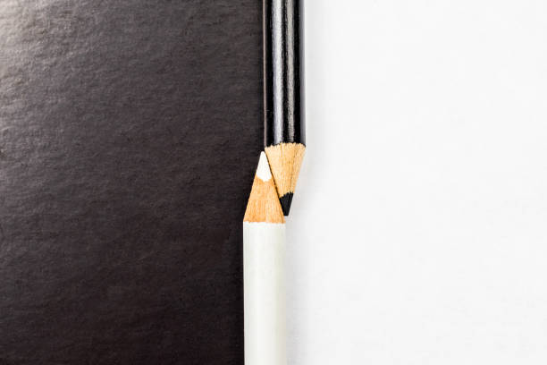 istock White and black pencils. Contrast and opposite concept 1307809493