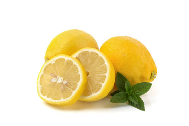 istock lemons whole and sliced, mint leaves, close-up on a white background, text space, horizontal view 1307811978