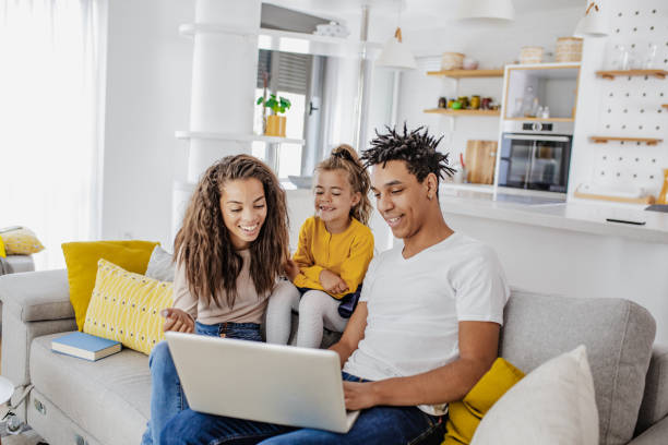 istock Young multi ethnic family is using laptop at home 1307818456