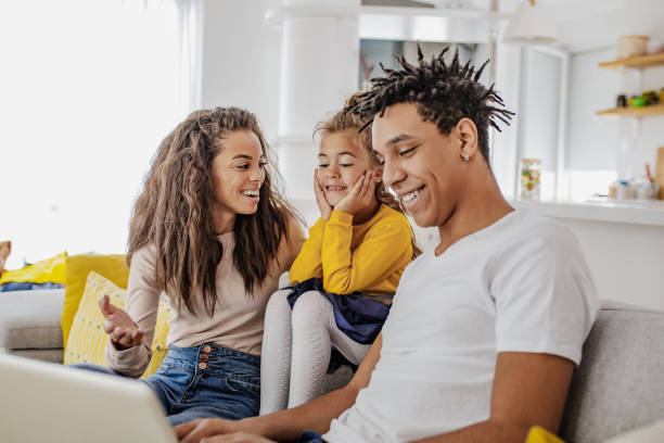 istock Young multi ethnic family is using laptop at home 1307818702