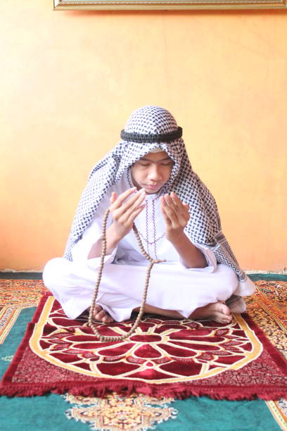 istock Muslim Teen Studies the Quran. 1307819607