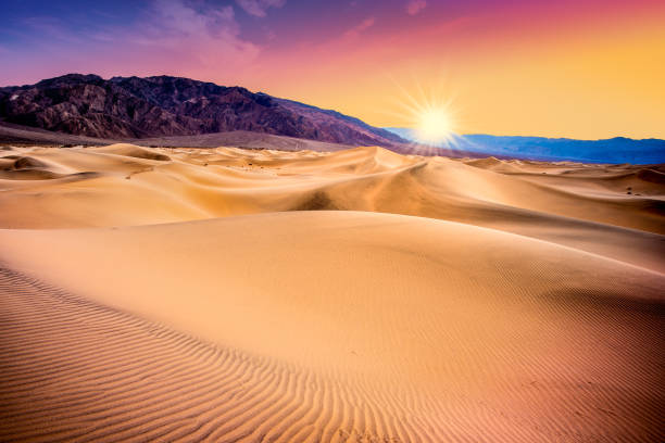 Sand Dunes Death Valley sunet Death Valley, California sand dunes with colorful sunset death valley desert photos stock pictures, royalty-free photos & images