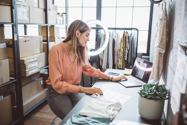 istock Young woman running online store 1307823596