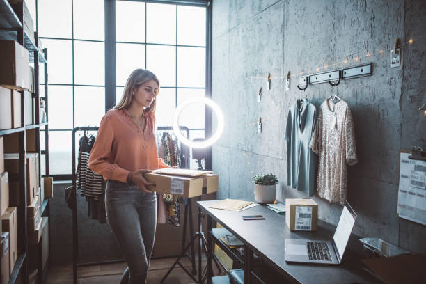 istock Young woman running online store 1307823648