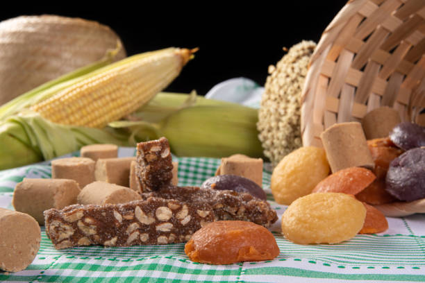 istock Festa Junina in Brazil, table with various sweets on a green and white checkered tablecloth, selective focus. 1307833367