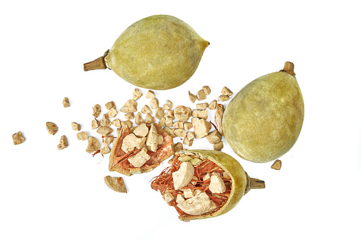 Baobab fruit both open and intact on white background