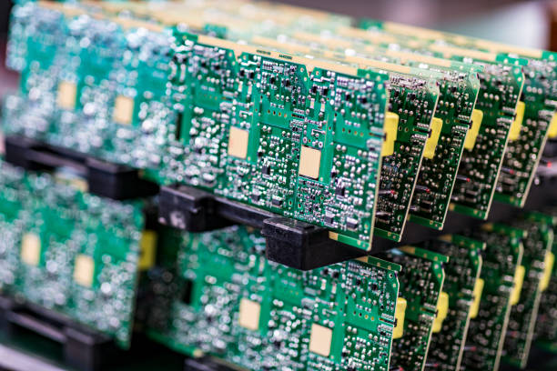 Circuit board with electronic components Blurred macro image of a row of microchips. computer chip stock pictures, royalty-free photos & images
