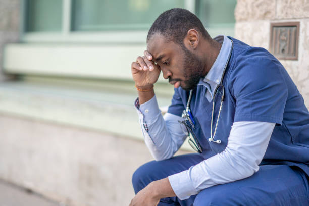 istock Male Doctor Having A Mental Burnout 1307842975