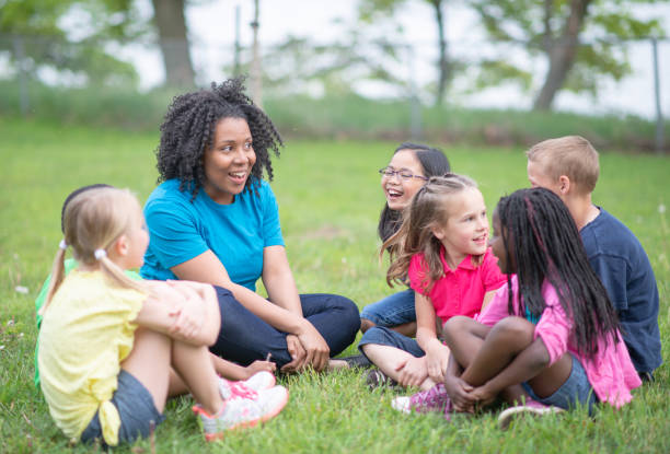 istock Camp Counselor and Children at Summer Camp 1307843004