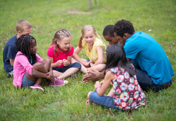 istock Camp Counselor and Children at Summer Camp 1307843008