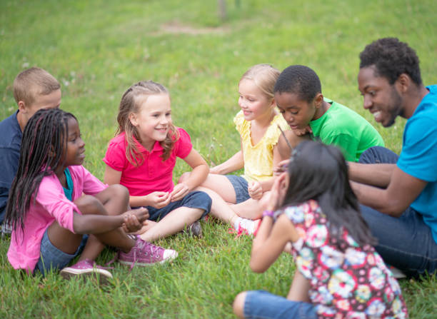 istock Camp Counselor and Children at Summer Camp 1307843024