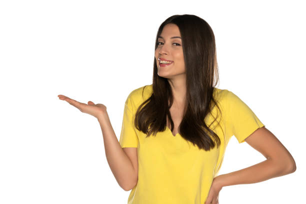 istock young beautiful woman holding imaginary object on her hand 1307843634
