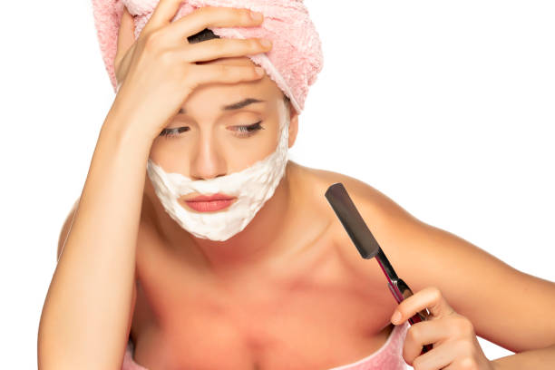 istock Young disappointed woman shaves her face 1307844483