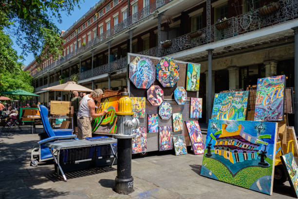 New Orleans, Louisiana USA - May 1, 2014: Unidentified street artist creating a new work in the popular Jackson Square in the French Quarter.