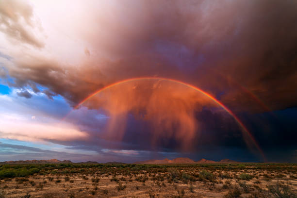 istock Rainbow with virga from a monsoon storm at sunset 1307845614