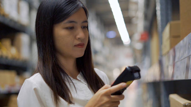 istock Female worker scanning products with barcode scanner in warehouse. 1307848684