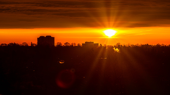 A sunrise over the sky of the city