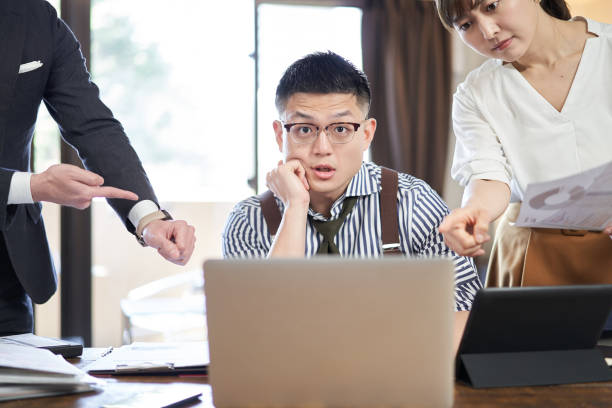 istock Asian male businessman surprised by workload and deadline 1307850403