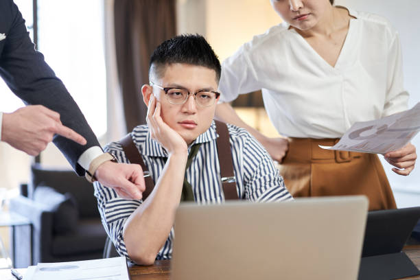 istock Asian male businessman chased by workload and deadlines 1307850404